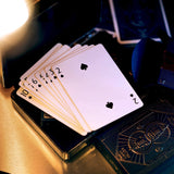 Playing cards with a deck on a reflective surface