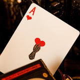 Playing card with a red heart symbol on a dark background