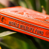 World Wildlife Fund playing card box on green leaves
