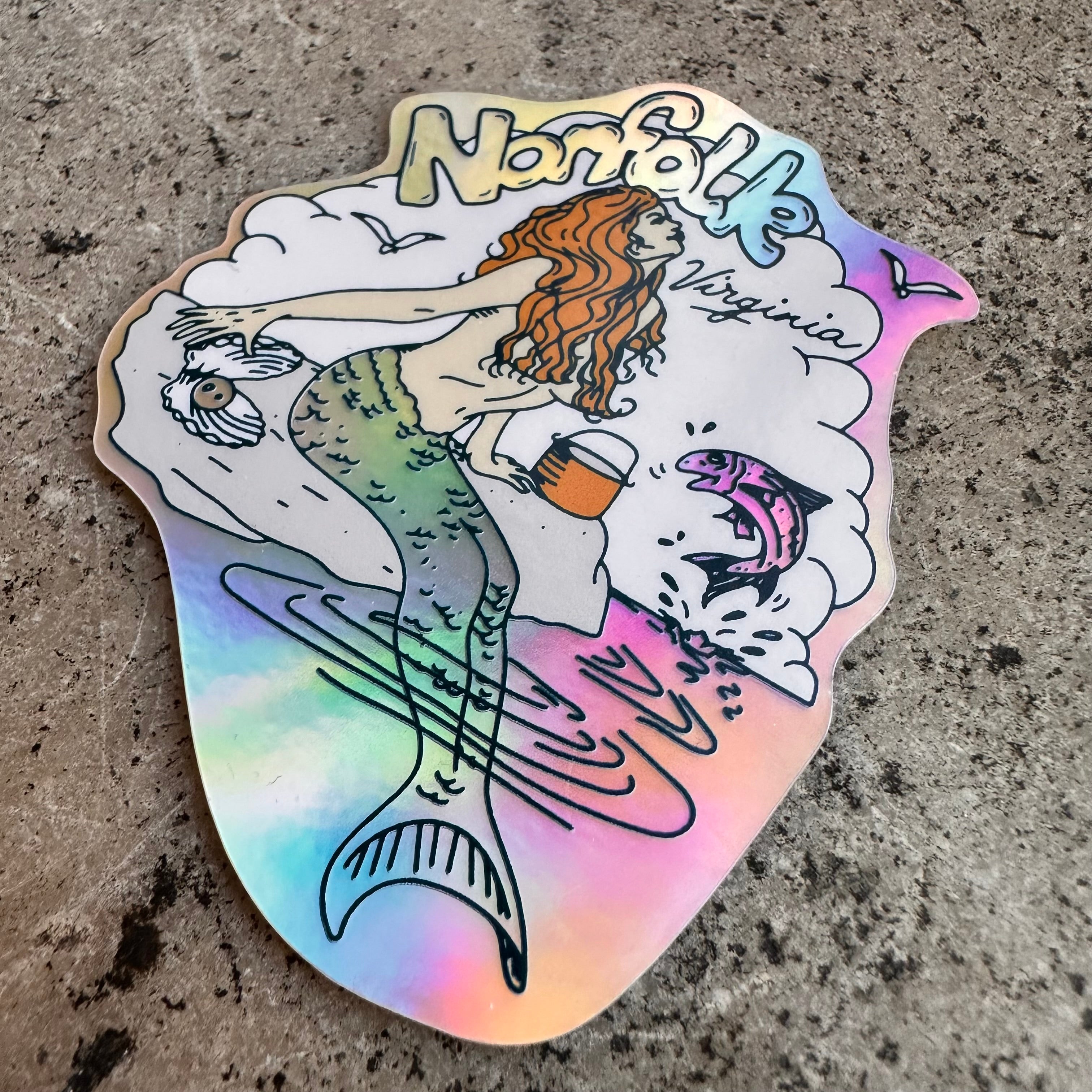 Screen printed holographic sticker of a retro mermaid and "Norfolk Virginia" in the background.