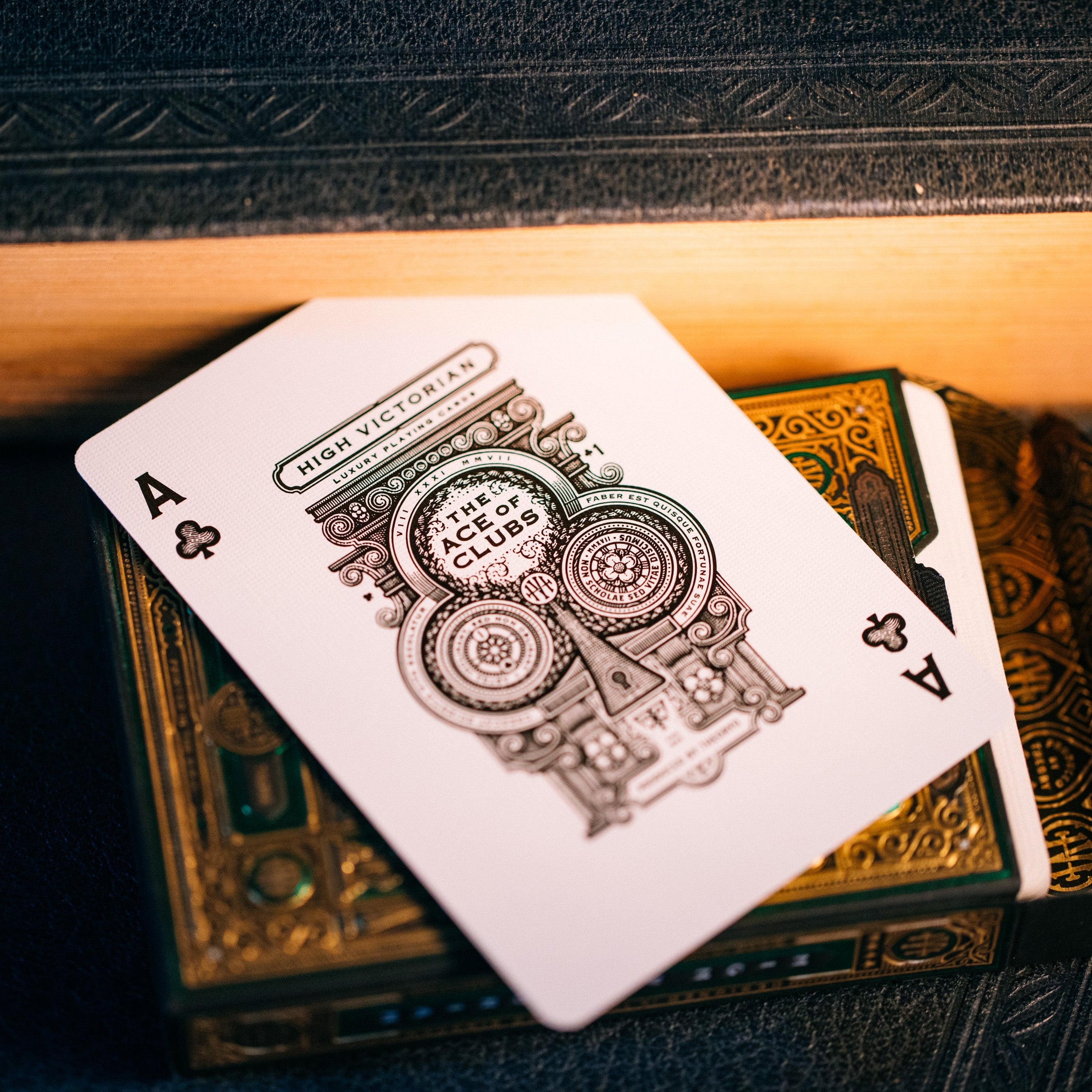 Playing card with intricate design on a wooden surface