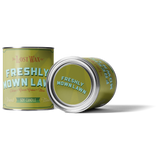 Two cans of 'Freshly Mown Lawn' candle by Lost Wax Co on a white background