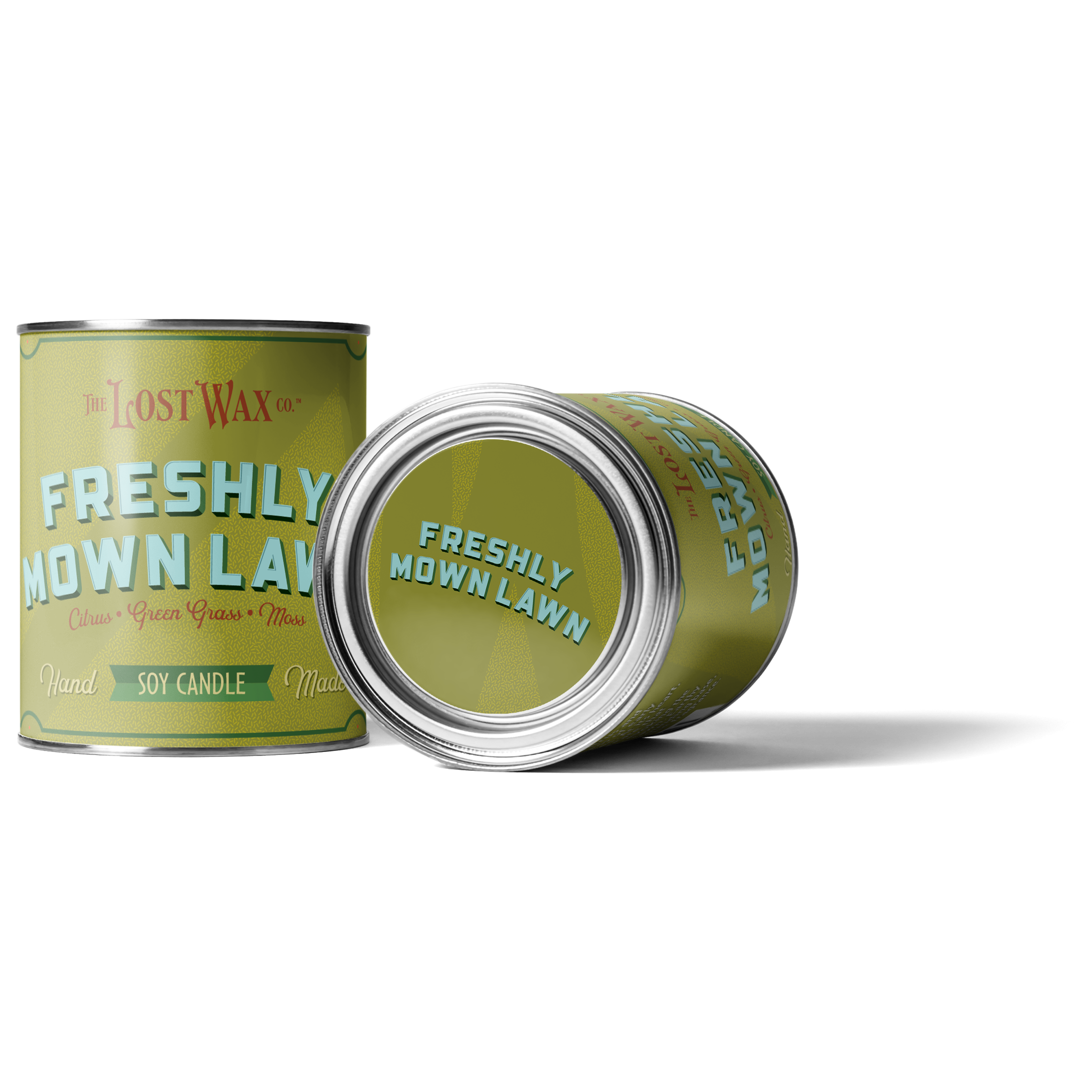 Two cans of 'Freshly Mown Lawn' candle by Lost Wax Co on a white background