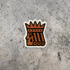 Screen printed vinyl die-cut sticker featuring a stylized prince wearing a crown, and a large teardrop.