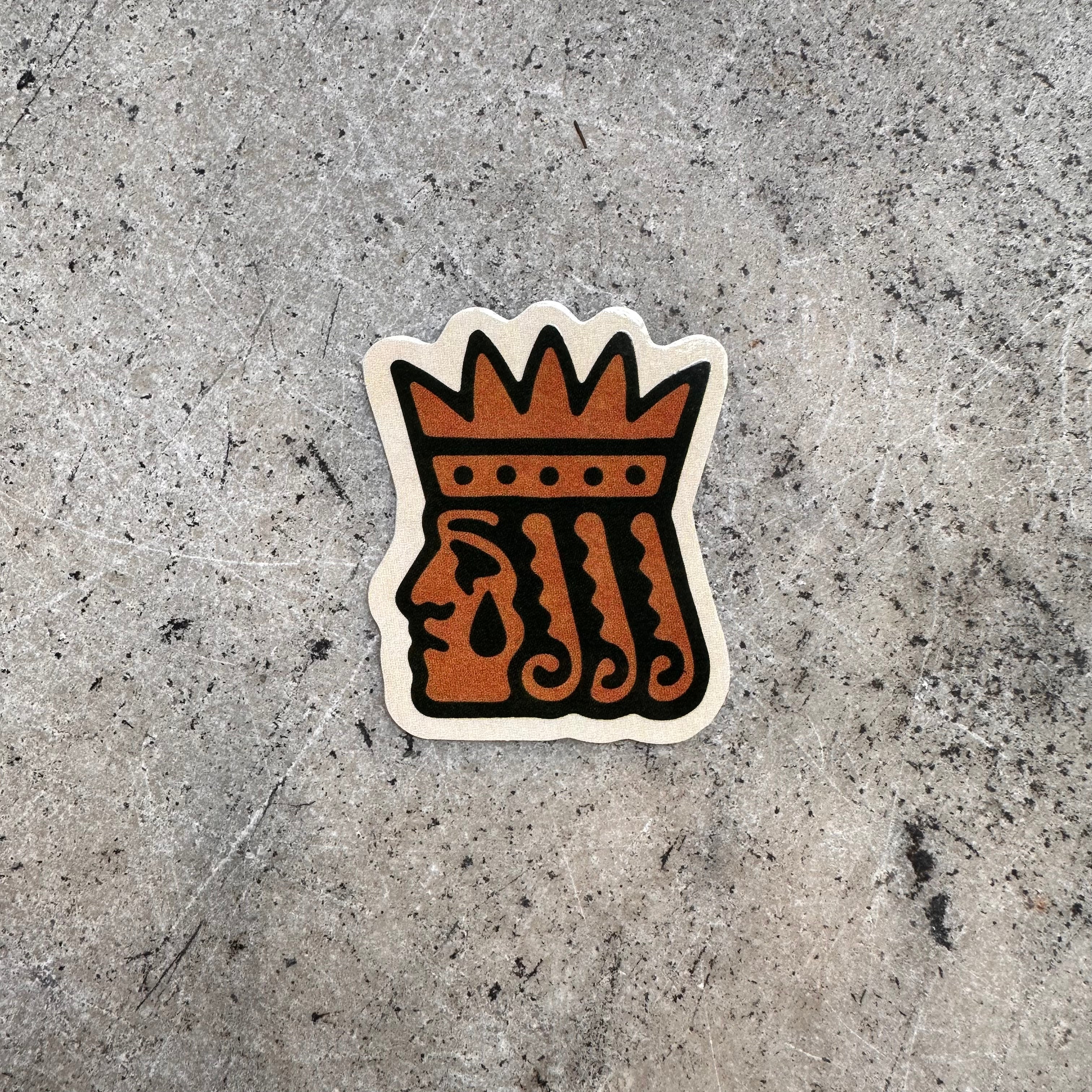 Screen printed vinyl die-cut sticker featuring a stylized prince wearing a crown, and a large teardrop.