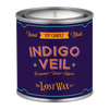 Candle in a purple canister with 'Indigo Veil' branding on a white background