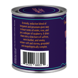 Back of a purple can with text and barcode on a white background