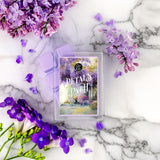 Wax melts packaging with purple flowers on a marble background