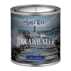 Candle in a tin labeled 'The Breakwater' from The Lost Wax Co. with a scenic design on the label.