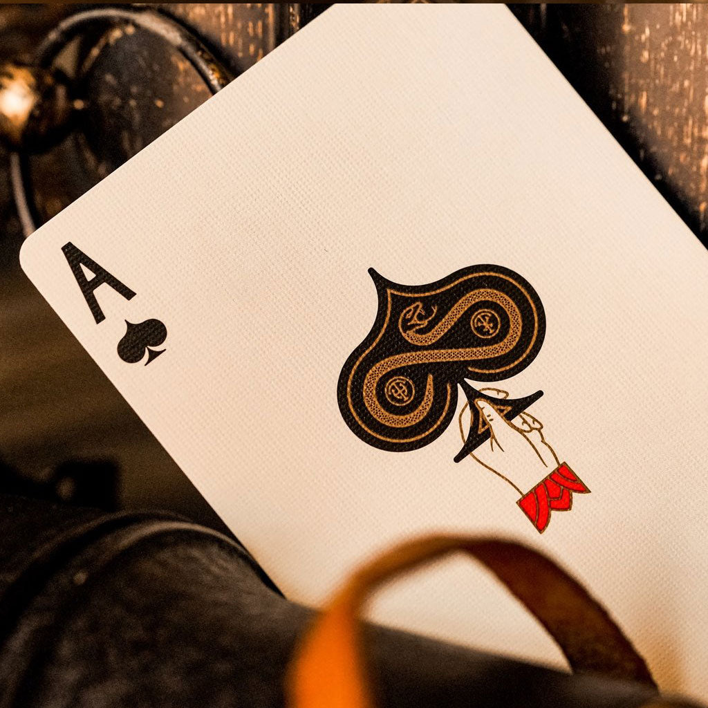 Ace of Spades playing card on a wooden surface