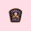 Embroidered patch featuring a skeleton at the steering wheel and the legend, "thrills and chills"
