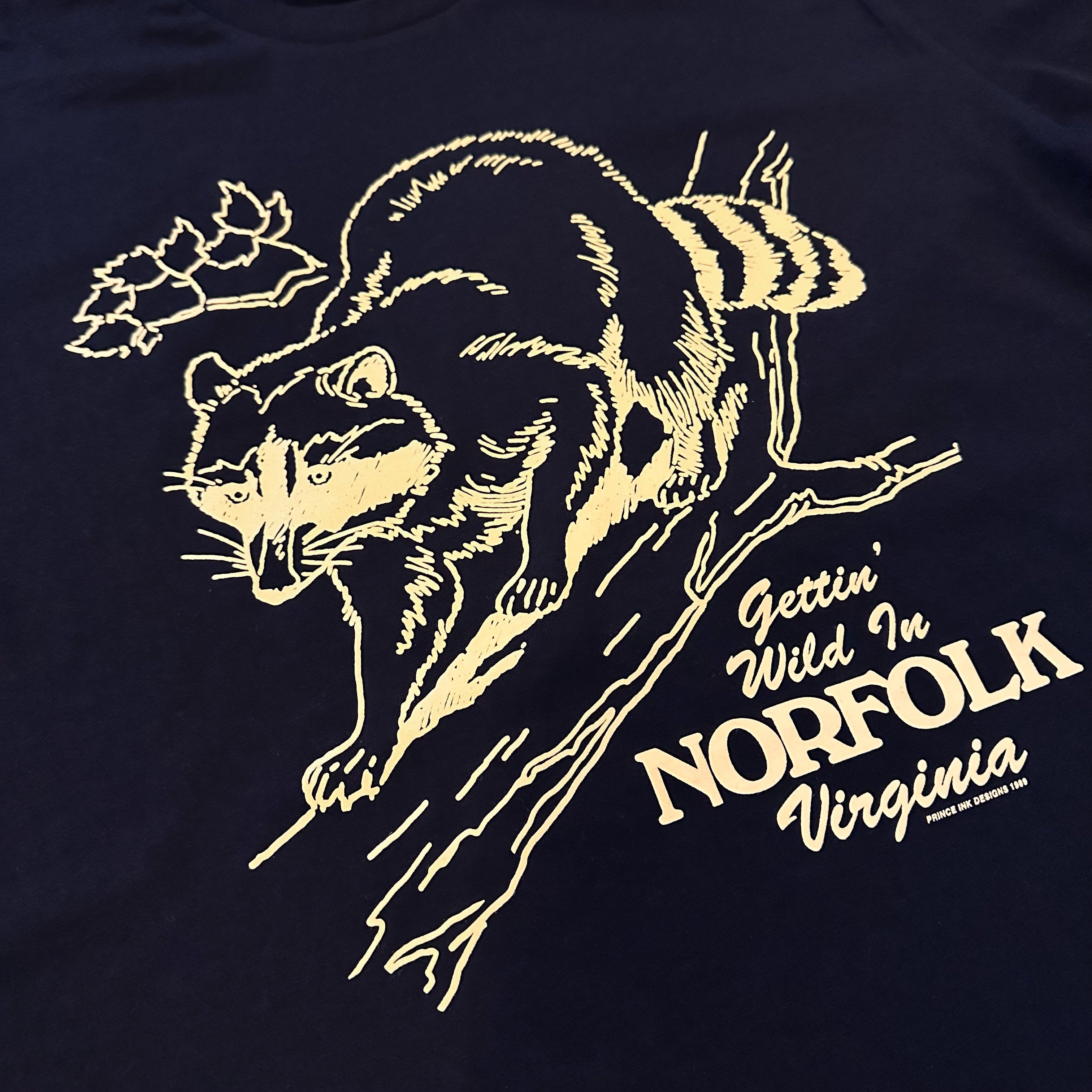 Closeup of tee with racoon and the text "Gettin' Wild In Norfolk Virginia"