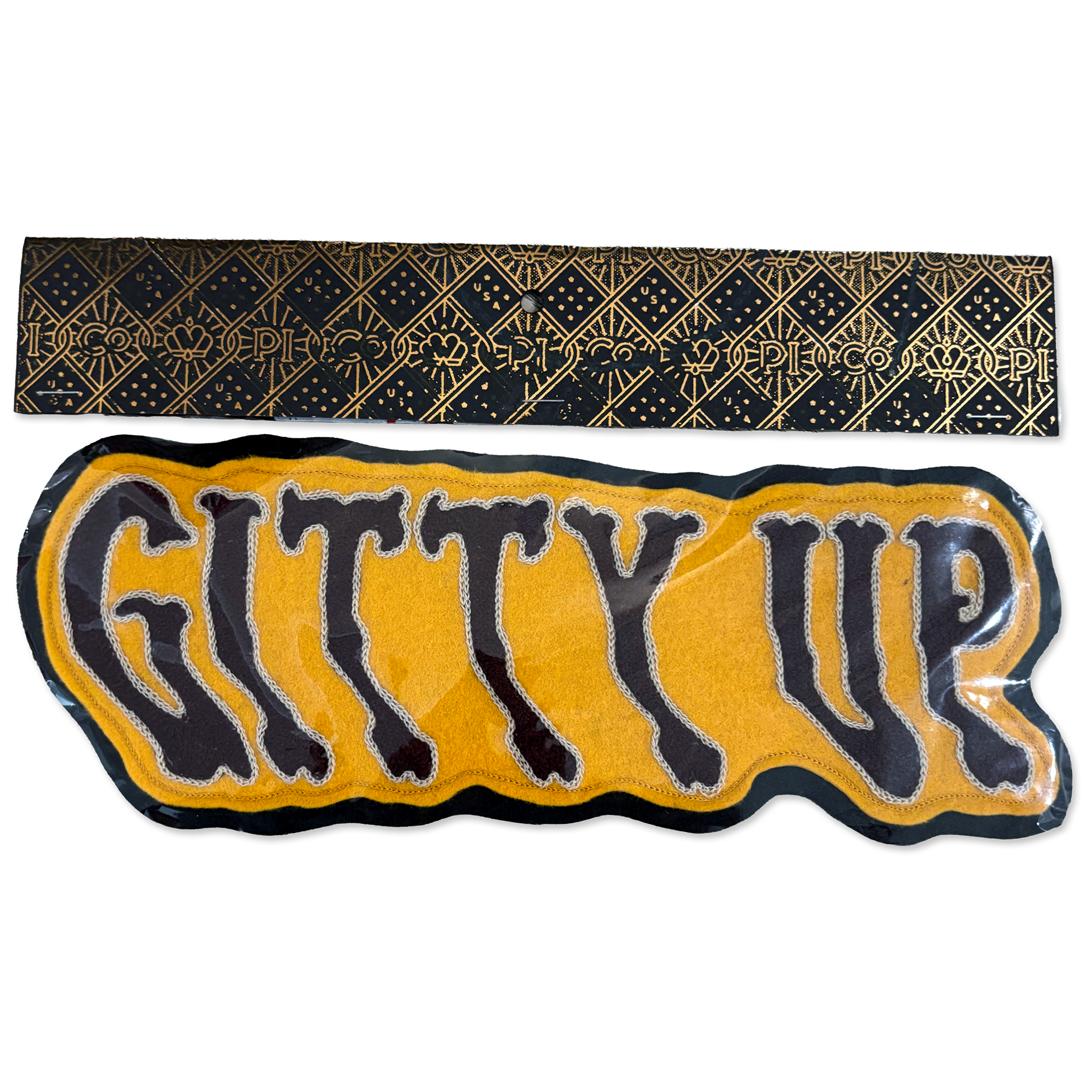 A black and gold patterned fabric headband shown above a matching black and yellow 'GITTY UP' patch on a white background.