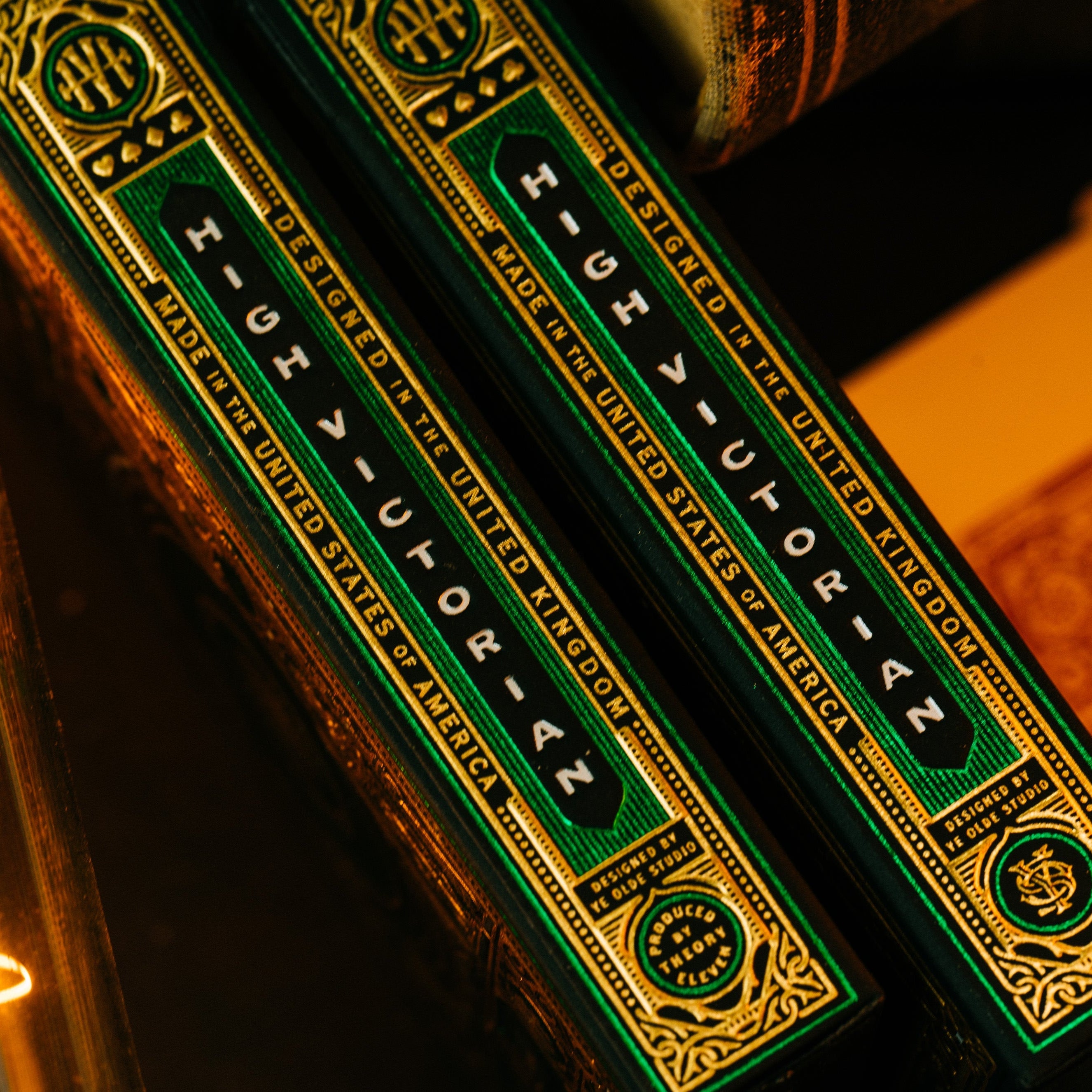 Two green and gold boxes with text on a dark background