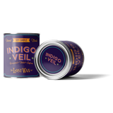 Two half-pint metal paint cans with labels that read "Indigo Veil" Hand Made Soy Wax Candle.
