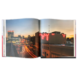 Double-page spread with a nighttime long exposure photograph of Granby street.