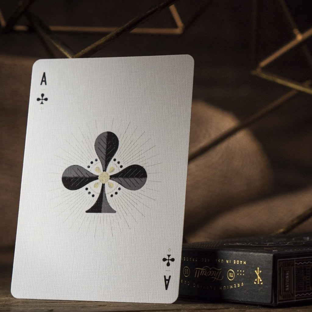 Ace of Clubs playing card on a wooden surface