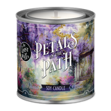 Candle in a decorative tin with 'Petals on the Path' design and 'The Lost Wax Co.' branding.