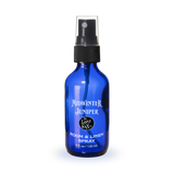 Blue spray bottle labeled 'Midwinter Juniper' on a white background