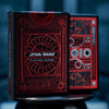 Two boxes of playing cards with metallic red foil design.