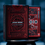 Two boxes of playing cards with metallic red foil design.