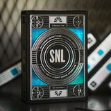 A pack of SNL playing cards with a black and blue design featuring the SNL logo and Studio 8H.